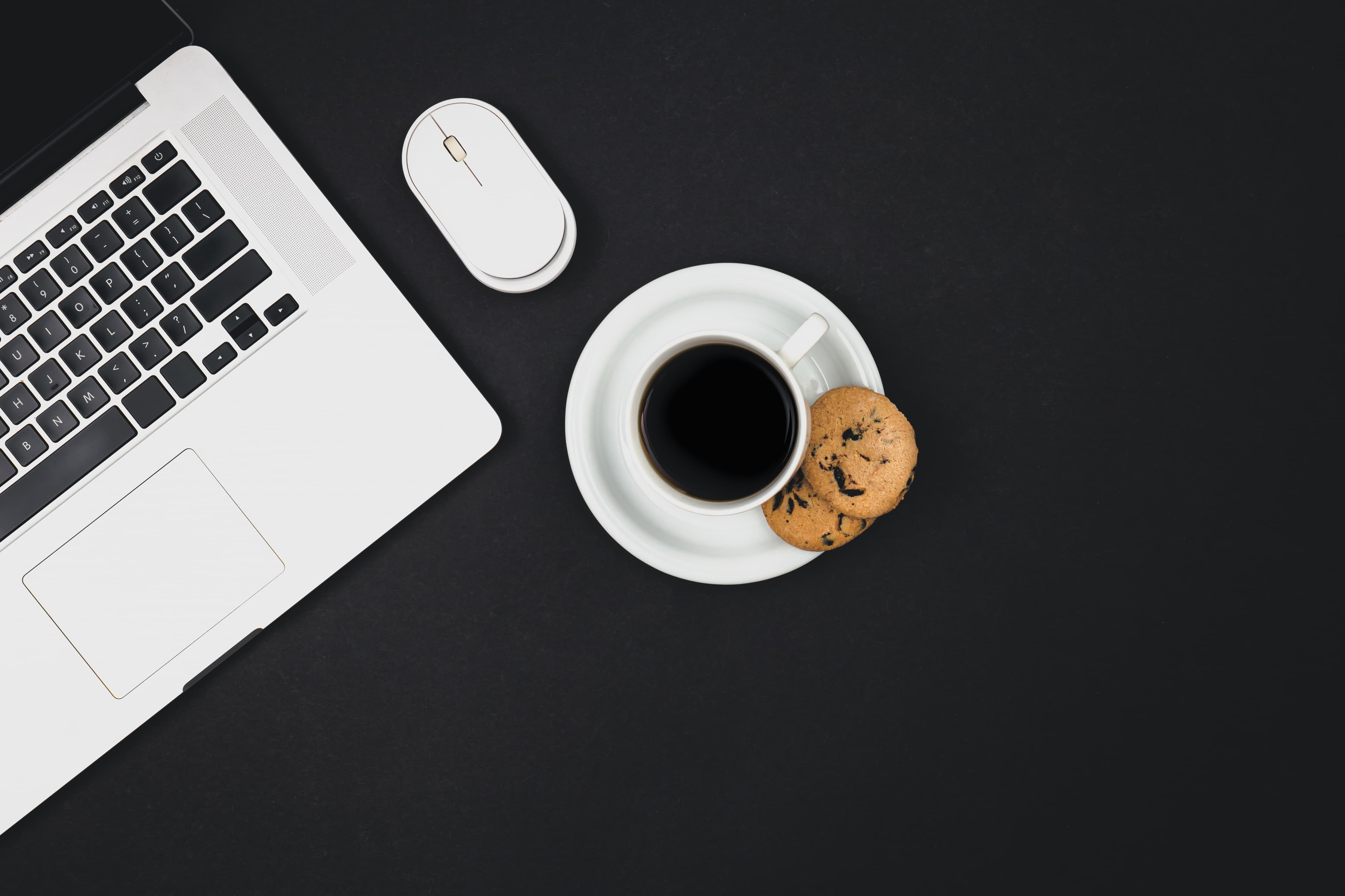 Laptop on dark background — get started