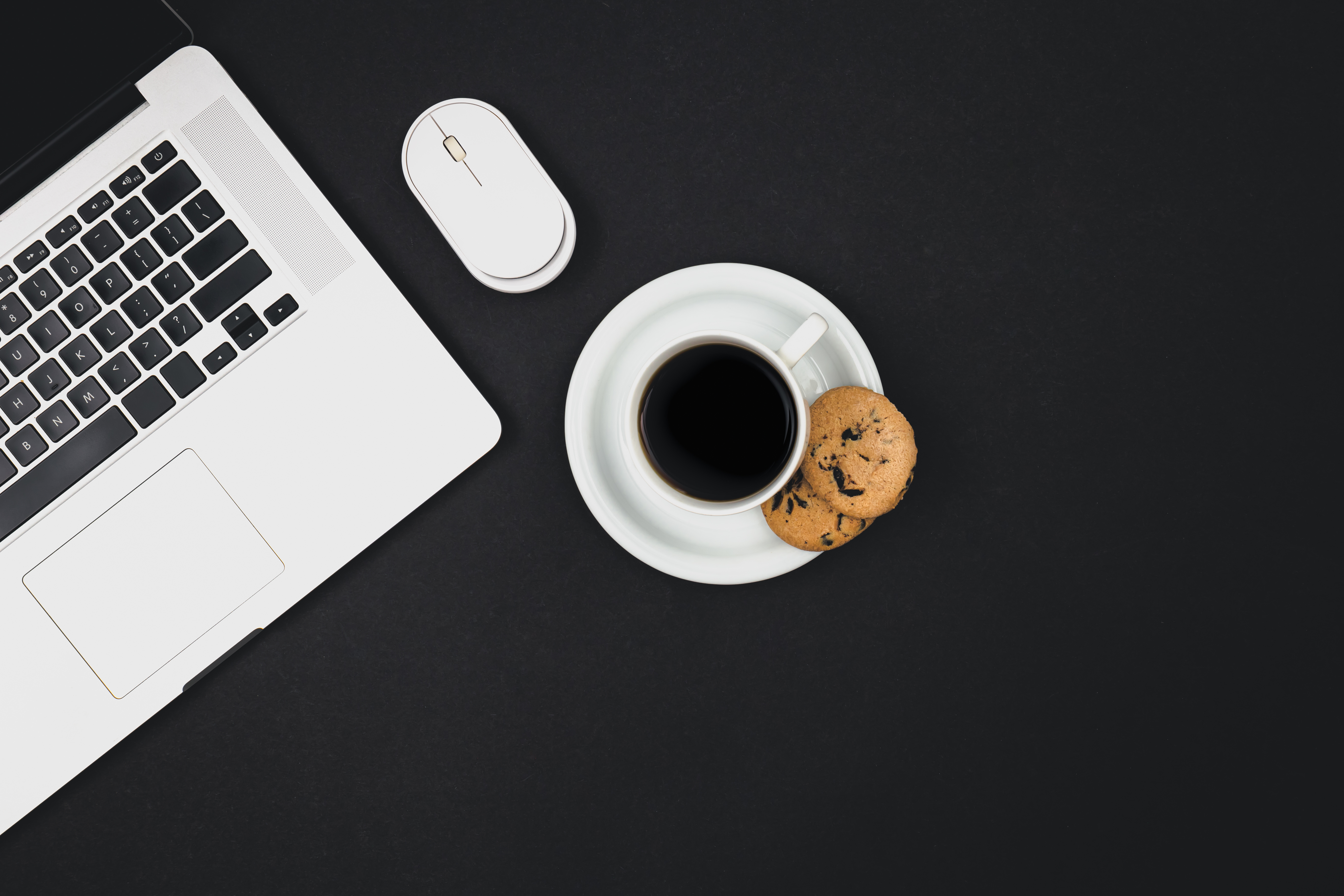 Laptop on dark background — get started